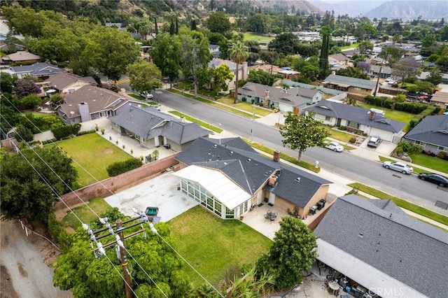 drone / aerial view with a residential view and a mountain view