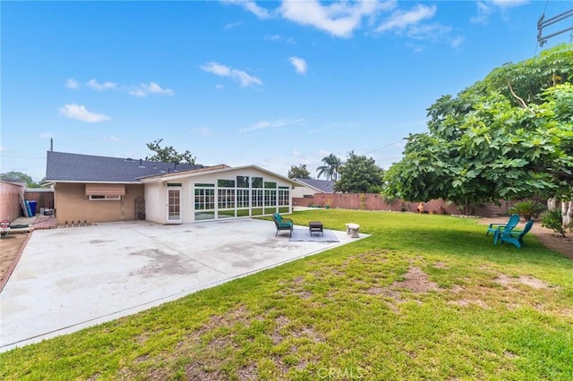 view of yard featuring a patio area and a fenced backyard