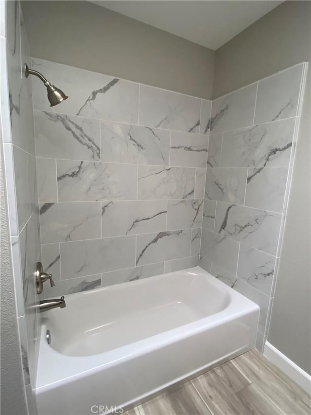 bathroom with  shower combination and wood finished floors
