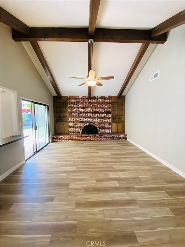 unfurnished living room with baseboards, visible vents, ceiling fan, a brick fireplace, and light wood-type flooring