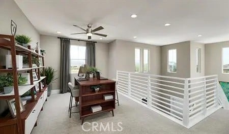 interior space with recessed lighting, light carpet, and a ceiling fan