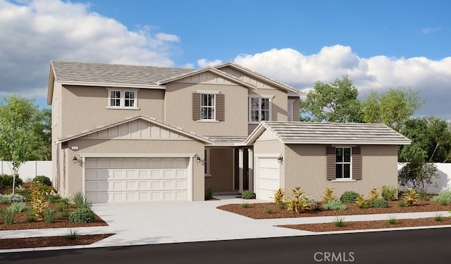 traditional-style home with stucco siding, driveway, and an attached garage