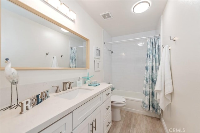 10 Windsong, Irvine, CA 92614 - full bathroom with vanity, toilet, wood finished floors, and shower / bath combo with shower curtain