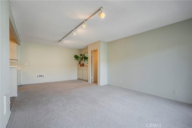 355 S Los Robles Ave Unit 310, Pasadena, CA 91101 - empty room with track lighting, light carpet, and a textured ceiling