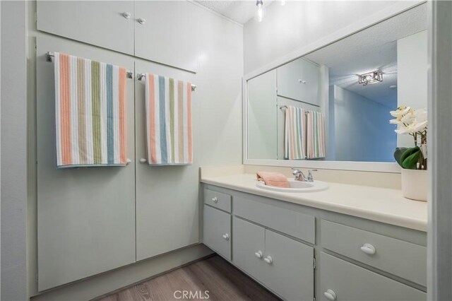 355 S Los Robles Ave Unit 310, Pasadena, CA 91101 - bathroom featuring vanity, wood finished floors, and a textured ceiling