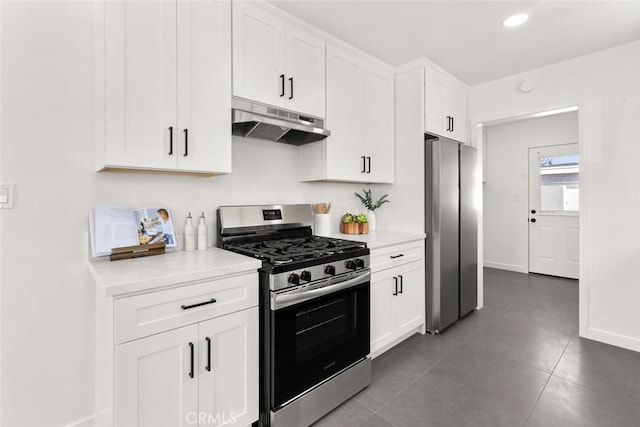 kitchen featuring under cabinet range hood, white cabinetry, appliances with stainless steel finishes, light countertops, and baseboards