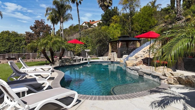 6756 Monte Verde Dr, San Diego, CA 92119 - view of swimming pool featuring a patio area, a fenced backyard, a fenced in pool, and a water slide