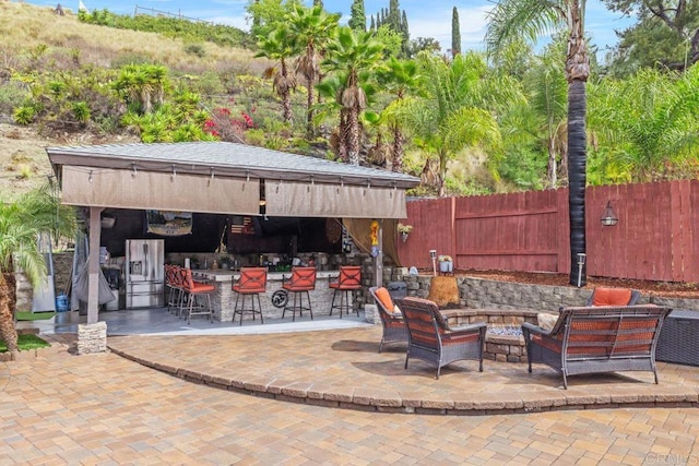 6756 Monte Verde Dr, San Diego, CA 92119 - view of patio / terrace with outdoor dry bar, outdoor lounge area, and fence