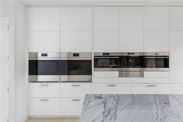 kitchen with modern cabinets and oven