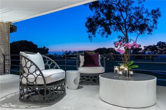 view of patio terrace at dusk