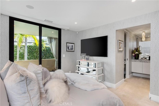 bedroom featuring visible vents, wallpapered walls, baseboards, and a textured wall