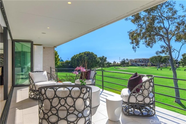 view of patio featuring a balcony