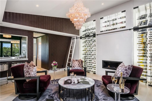 living room with wood finished floors and a chandelier