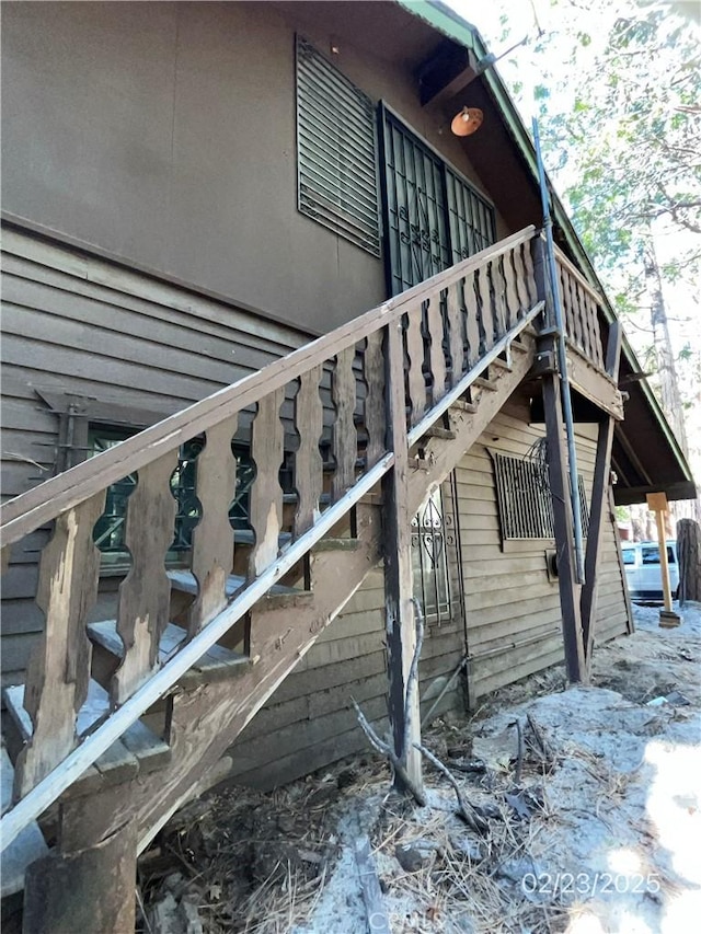 view of property exterior featuring stairway