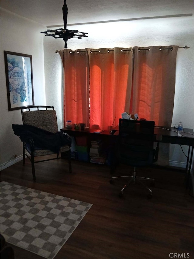 home office with baseboards and wood finished floors