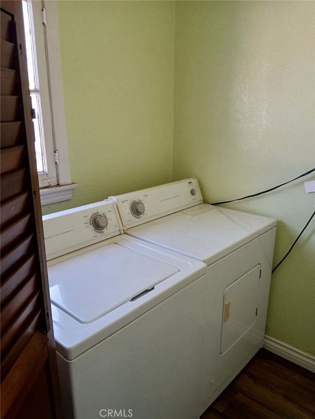 washroom with laundry area, dark wood-style flooring, and washer and clothes dryer