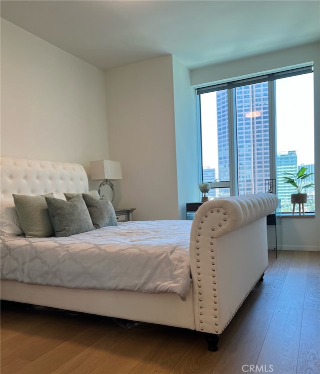 bedroom featuring wood finished floors