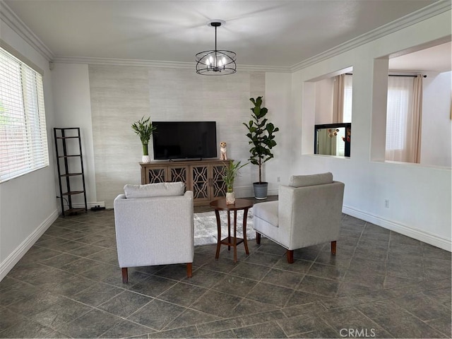 living room featuring baseboards, a notable chandelier, and ornamental molding