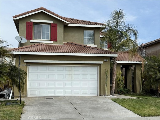 traditional-style house featuring stucco siding, driveway, and a tiled roof