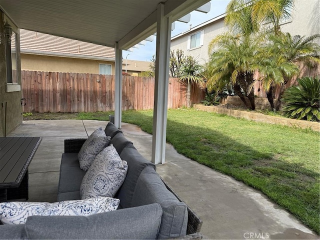 view of patio with an outdoor hangout area and fence