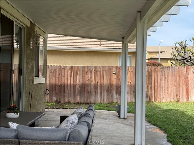 view of patio / terrace featuring an outdoor hangout area and fence