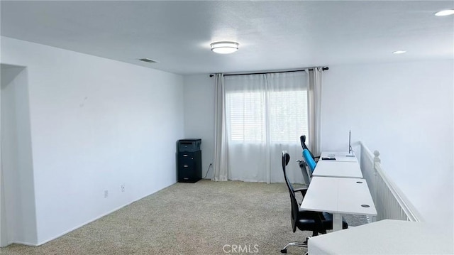 carpeted home office featuring visible vents