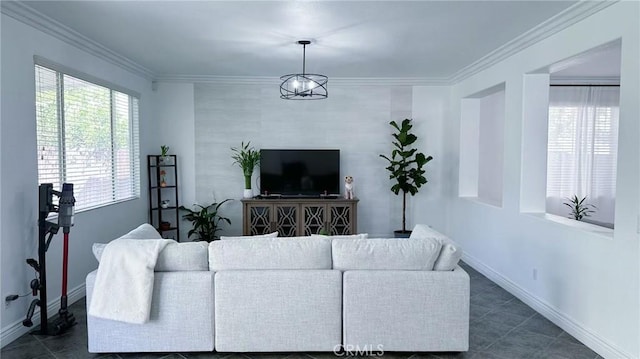 living room with dark tile patterned flooring, baseboards, and ornamental molding