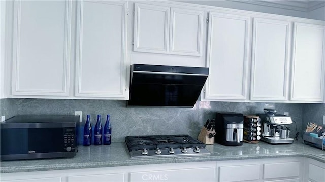 kitchen with exhaust hood, white cabinetry, and stainless steel appliances