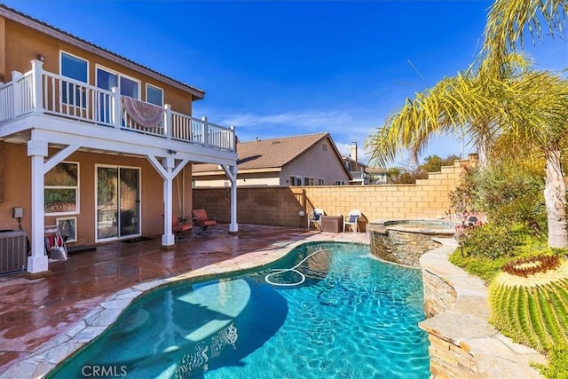 view of swimming pool featuring a fenced in pool, cooling unit, a fenced backyard, and a patio area