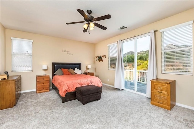 bedroom with visible vents, carpet flooring, baseboards, and access to outside