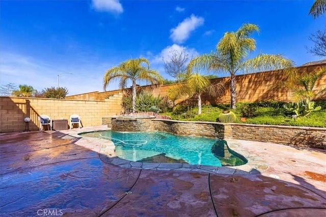 view of swimming pool featuring a fenced in pool, grilling area, a fenced backyard, and a patio area