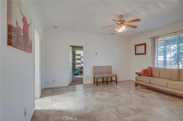 39100 Saddle Ridge Rd, Hemet, CA 92543 - living area with baseboards, plenty of natural light, ornamental molding, and a ceiling fan