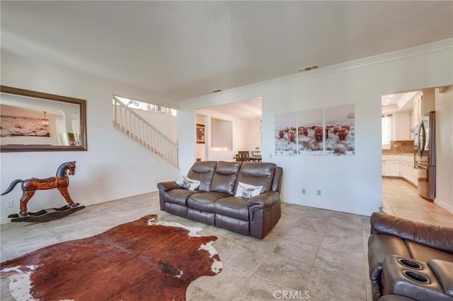 39100 Saddle Ridge Rd, Hemet, CA 92543 - living area featuring visible vents, baseboards, stairs, and crown molding