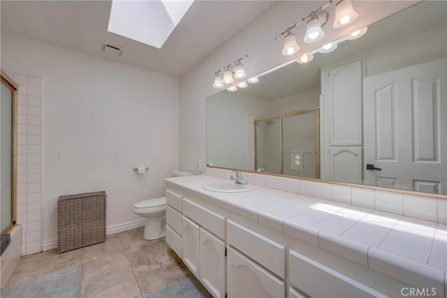 39100 Saddle Ridge Rd, Hemet, CA 92543 - full bathroom featuring visible vents, toilet, a skylight, tile patterned flooring, and vanity