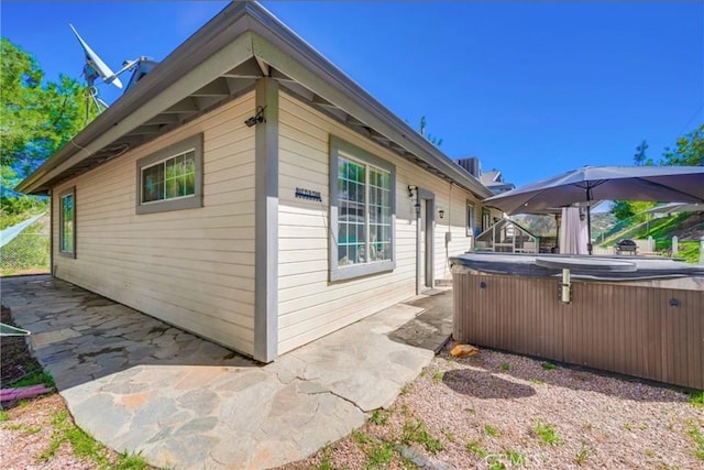 39100 Saddle Ridge Rd, Hemet, CA 92543 - view of side of home featuring a patio and a hot tub