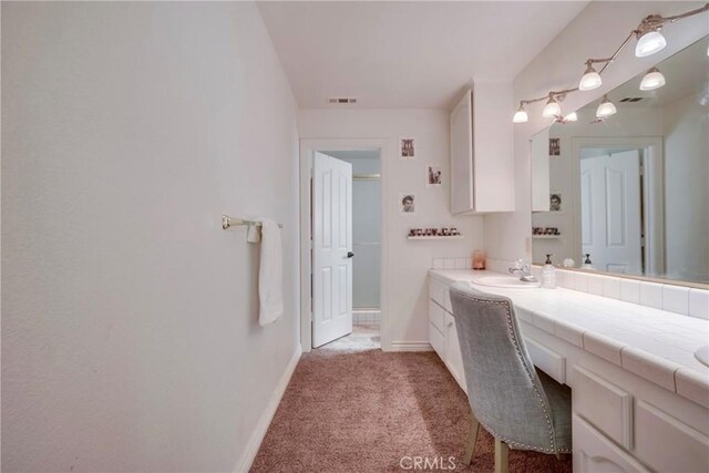 39100 Saddle Ridge Rd, Hemet, CA 92543 - bathroom with visible vents, vanity, and baseboards
