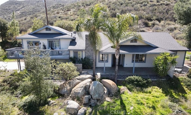 39100 Saddle Ridge Rd, Hemet, CA 92543 - view of front of home featuring a patio area and a wooden deck