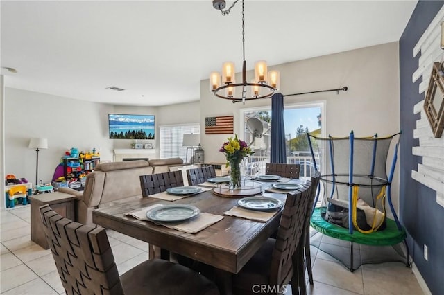 2810 Green River Rd Unit 103, Corona, CA 92882 - dining room with a chandelier, light tile patterned floors, and plenty of natural light
