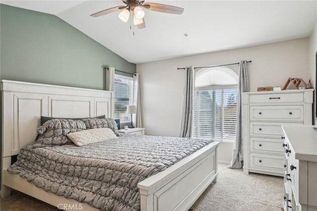 2810 Green River Rd Unit 103, Corona, CA 92882 - bedroom featuring light carpet, vaulted ceiling, multiple windows, and a ceiling fan