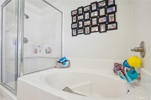 2810 Green River Rd Unit 103, Corona, CA 92882 - bathroom featuring a stall shower and a bath
