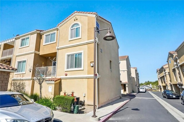 2810 Green River Rd Unit 103, Corona, CA 92882 - view of asphalt street with a residential view