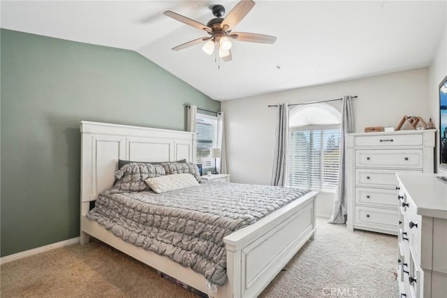 2810 Green River Rd Unit 103, Corona, CA 92882 - bedroom with light carpet, vaulted ceiling, a ceiling fan, and baseboards