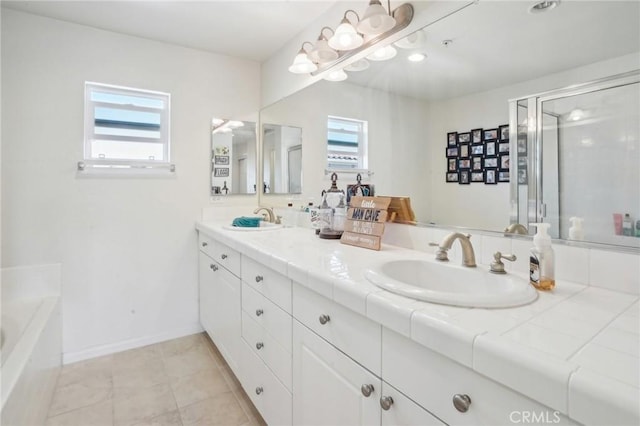 2810 Green River Rd Unit 103, Corona, CA 92882 - bathroom featuring double vanity, a bath, a stall shower, tile patterned flooring, and baseboards