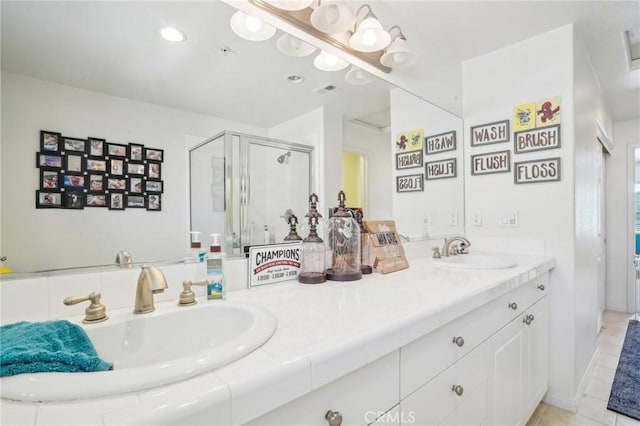 2810 Green River Rd Unit 103, Corona, CA 92882 - bathroom with a shower stall, double vanity, and tile patterned flooring
