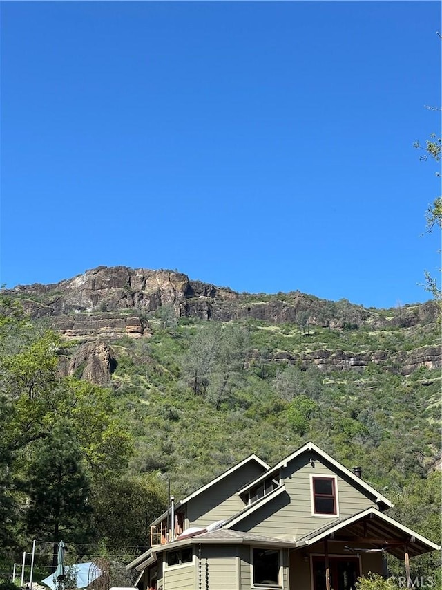 property view of mountains with a forest view