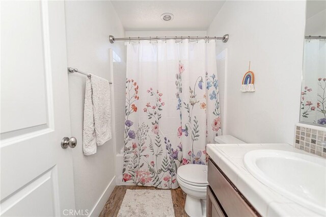 148 Mesquite Ct, Calimesa, CA 92320 - bathroom with toilet, shower / bath combo with shower curtain, and vanity