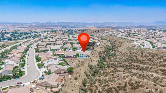 148 Mesquite Ct, Calimesa, CA 92320 - aerial overview of property's location featuring a mountainous background and nearby suburban area