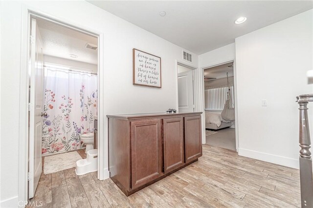 148 Mesquite Ct, Calimesa, CA 92320 - corridor with baseboards, light wood-style flooring, visible vents, and recessed lighting