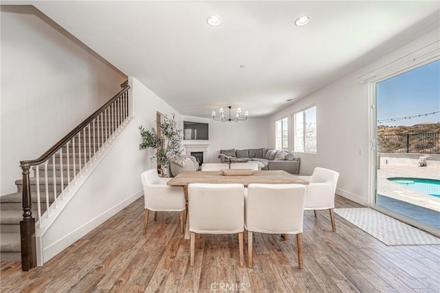 148 Mesquite Ct, Calimesa, CA 92320 - living area featuring stairs, wood finished floors, a chandelier, and recessed lighting
