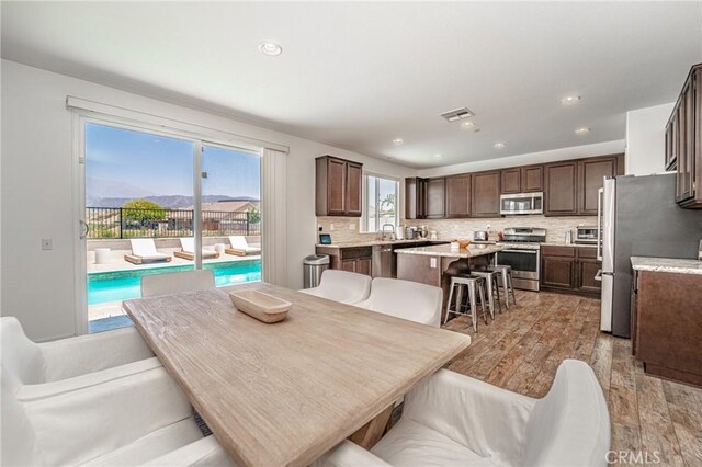 148 Mesquite Ct, Calimesa, CA 92320 - dining area with visible vents, recessed lighting, and light wood-type flooring